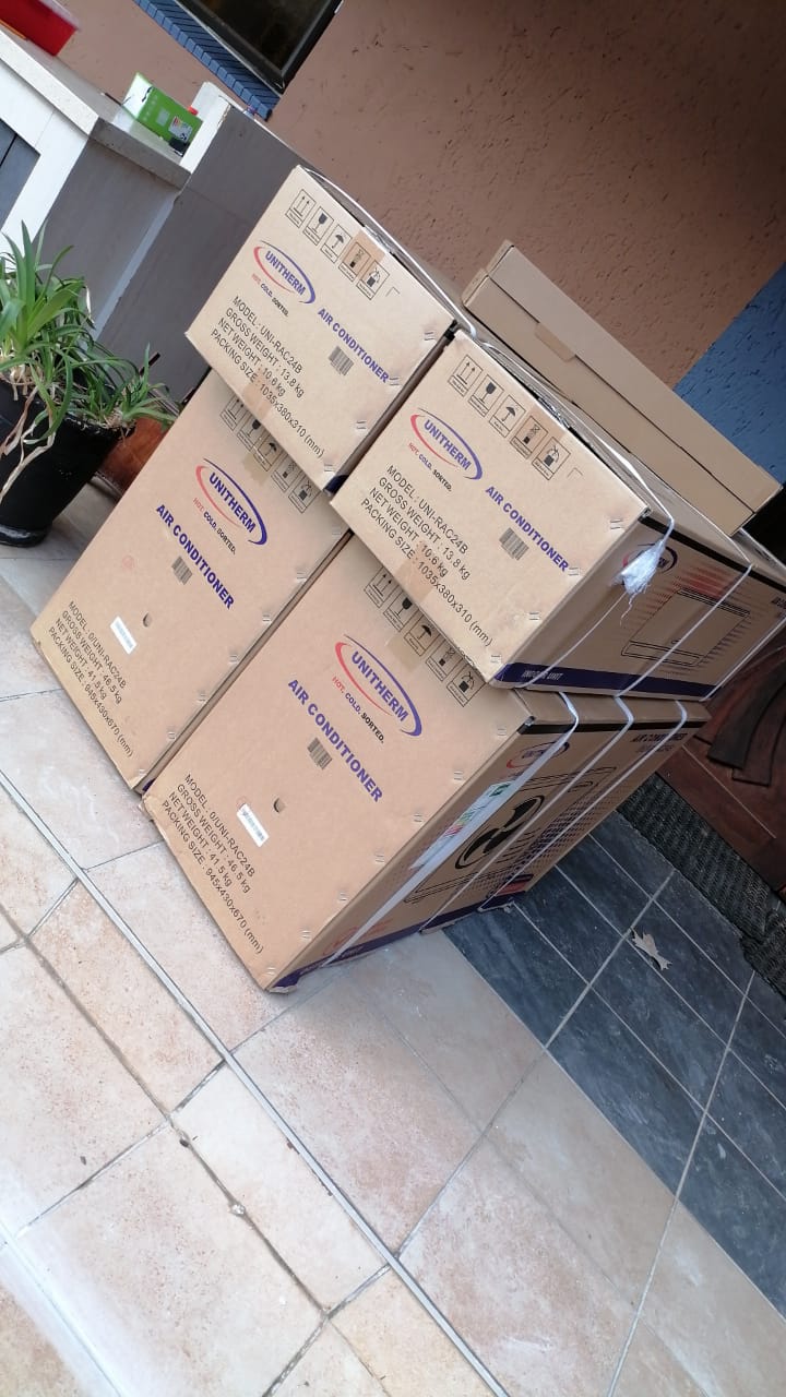 GLS team working on commercial AC unit